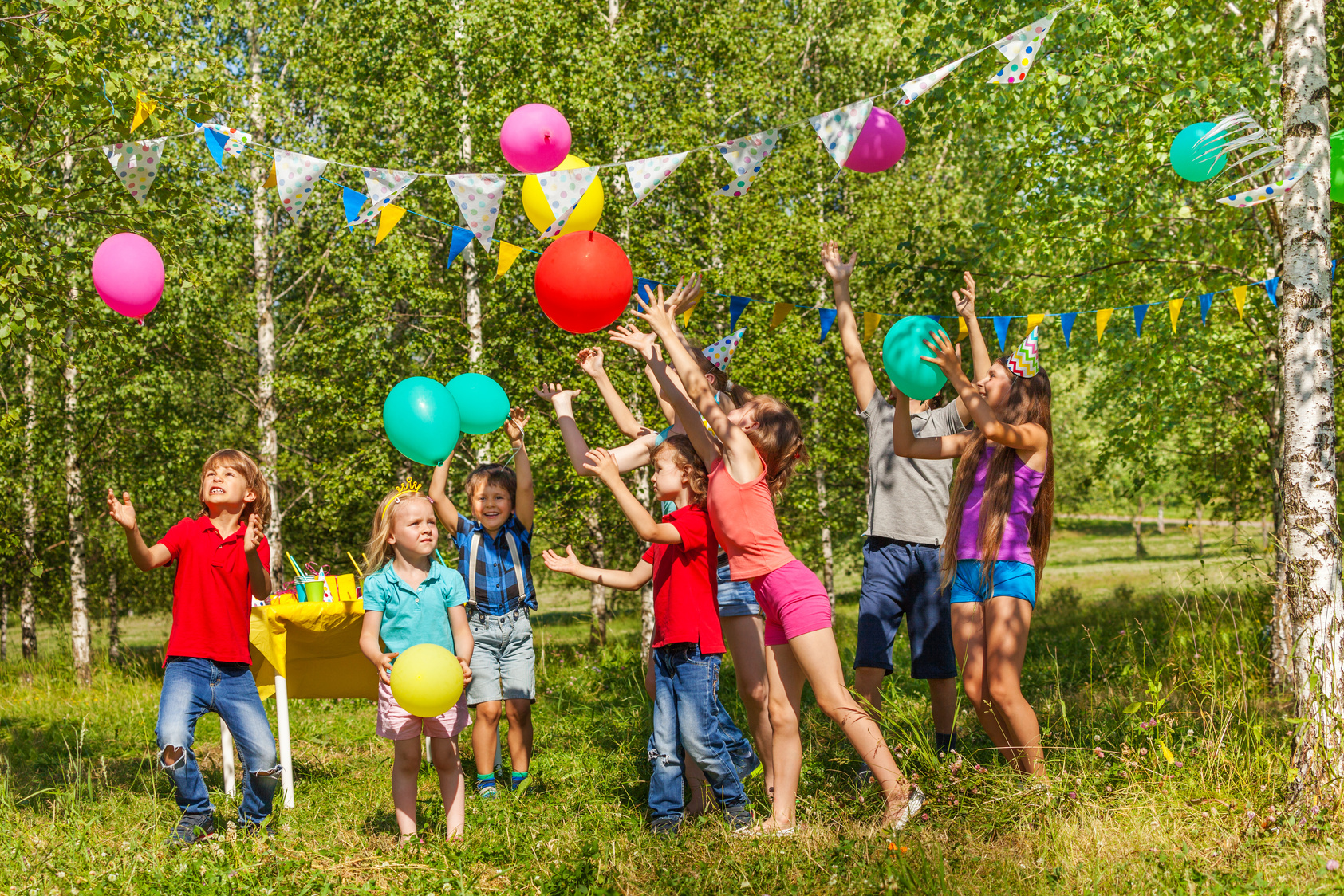 Happy Kids Having Fun Playing Balloons outside